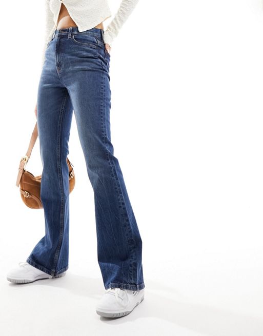 ASOS DESIGN flared jeans in dark blue with split hem