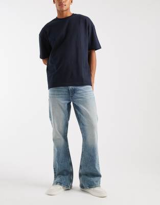 Asos Design Flared Jeans In Blue