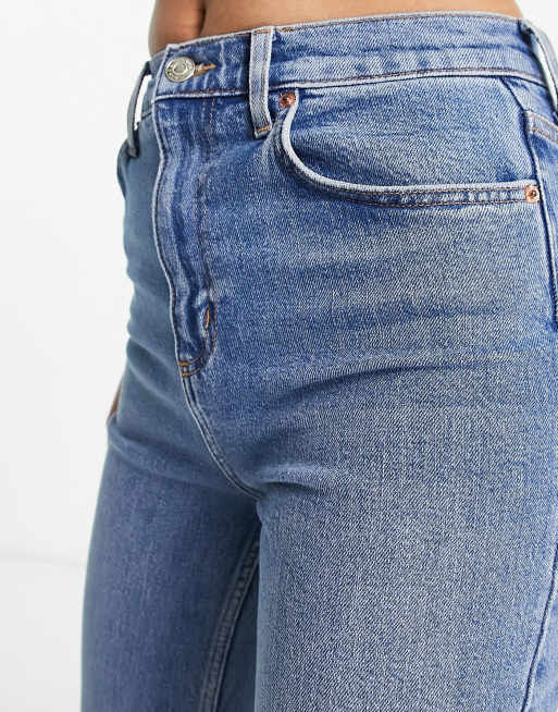 ASOS DESIGN low rise flared jeans with western pocket detail in dark blue