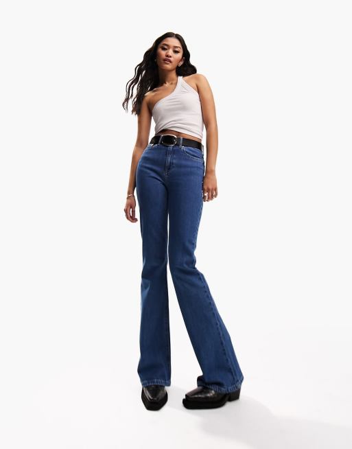 ASOS DESIGN Petite super low rise flare jeans in mid wash blue