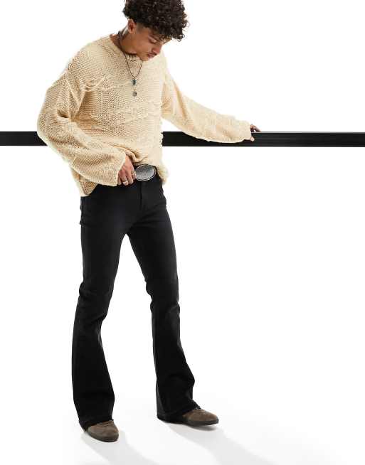 ASOS DESIGN - Flared jeans met stretch en onafgewerkte zoom in zwart met wassing