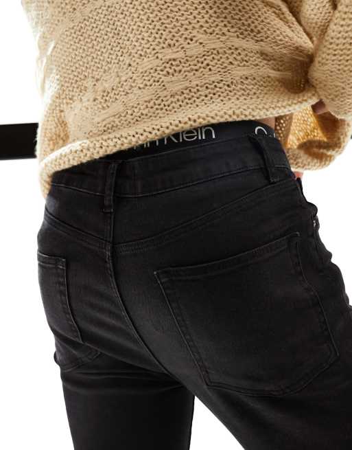 ASOS DESIGN - Flared jeans met stretch en onafgewerkte zoom in zwart met wassing, 3 van 6