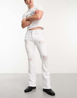 ASOS DESIGN flared jeans with distressed rips in white | ASOS