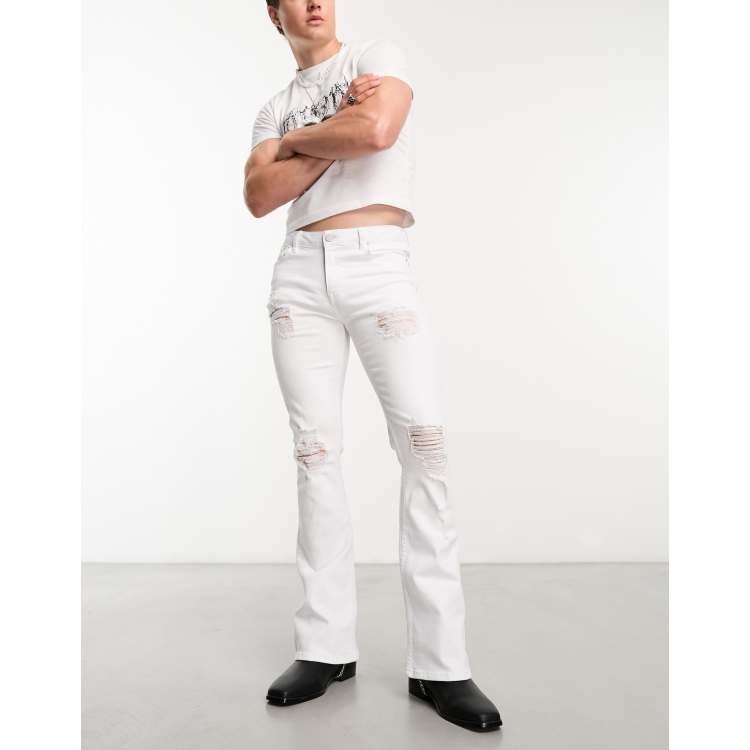 ASOS DESIGN flared jeans with distressed rips in white