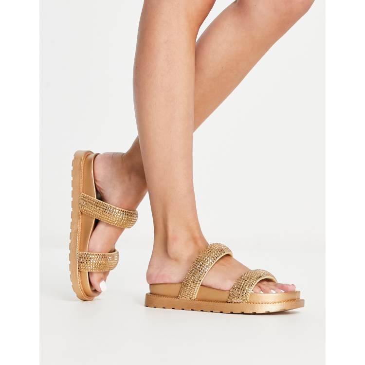 ASOS DESIGN Flatter embellished footbed flat sandals in gold ASOS