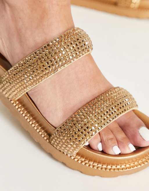 ASOS DESIGN Flatter embellished footbed flat sandals in gold ASOS