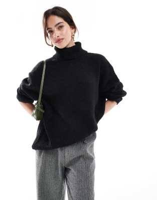 ASOS DESIGN - Flauschiger Longline-Pullover in Schwarz mit Rollkragen