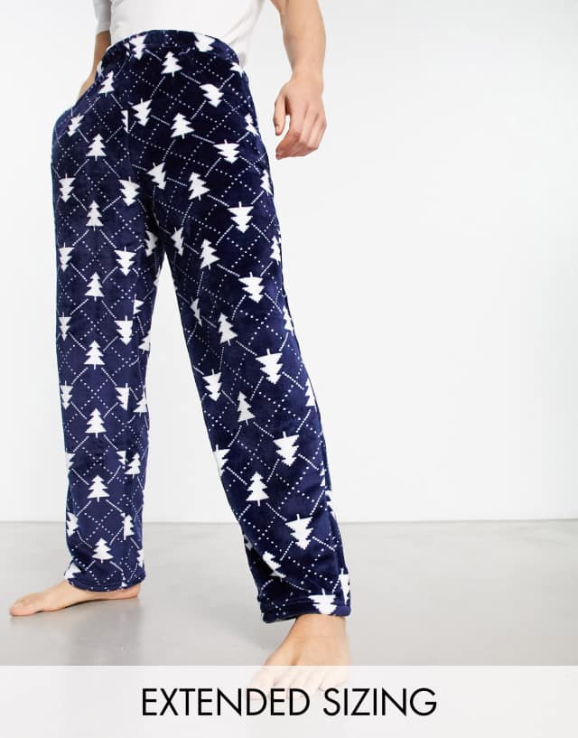 ASOS DESIGN fleece lounge bottoms in navy Christmas tree print