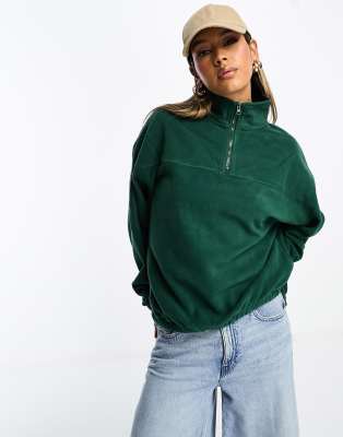 ASOS DESIGN - Fleece-Sweatshirt in Tannengrün mit kurzem Reißverschluss