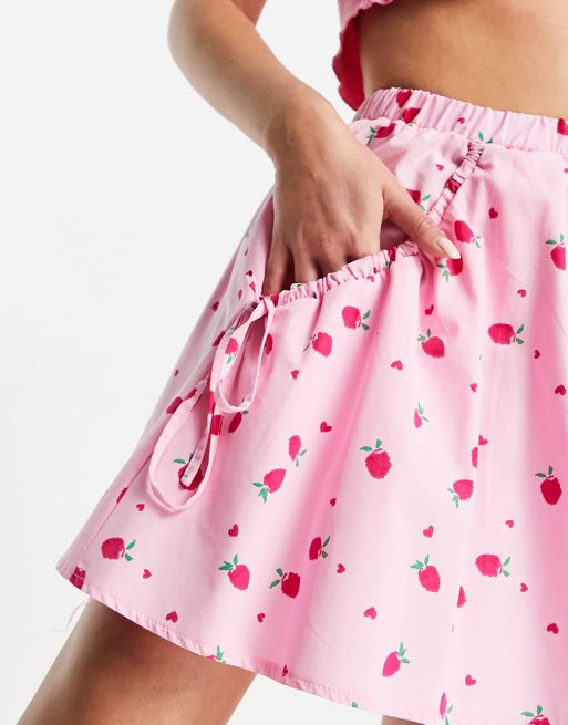 ASOS DESIGN flippy mini skirt in pink strawberry print