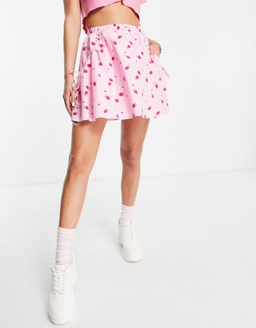ASOS DESIGN flippy mini skirt in pink strawberry print