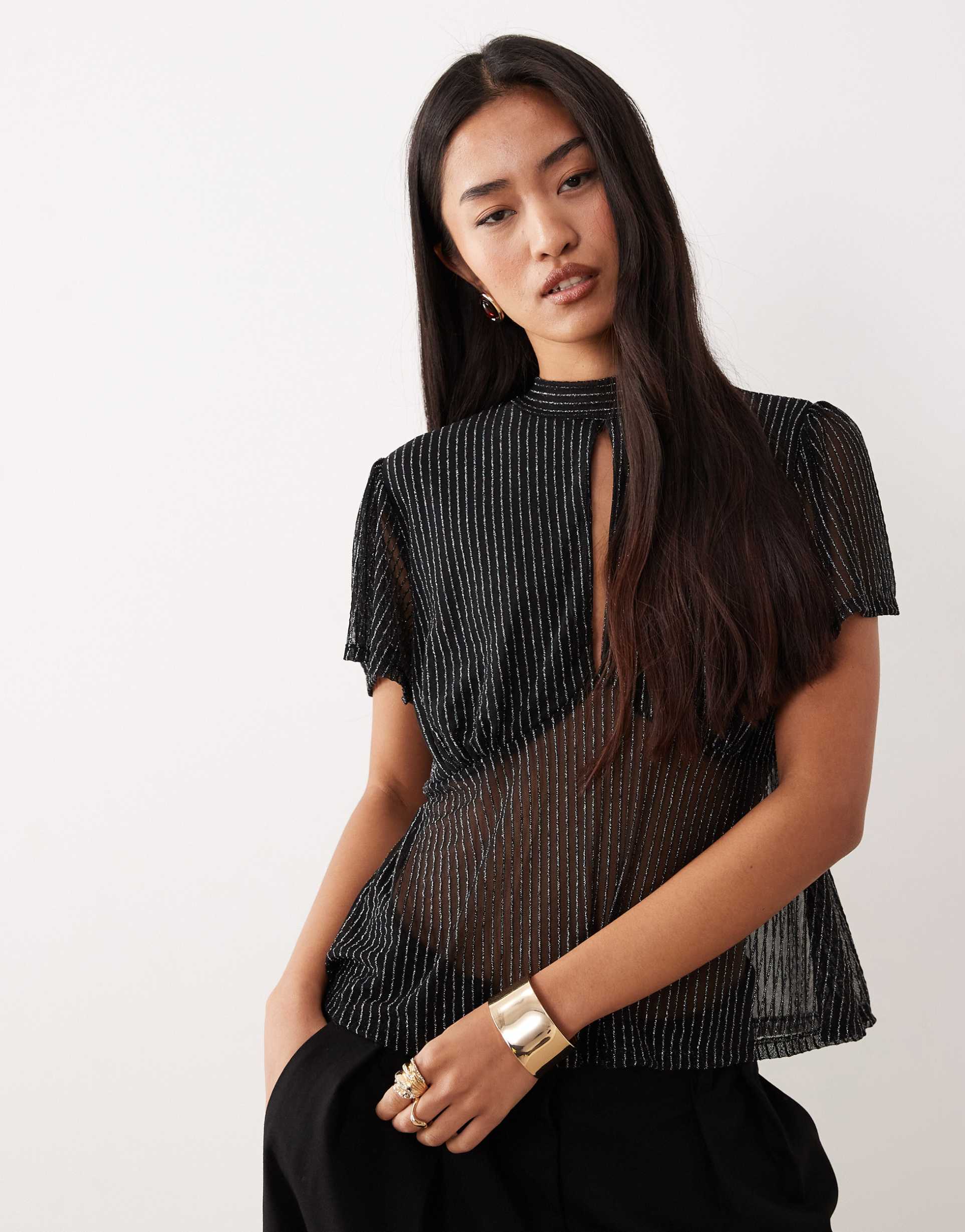 asos design floaty mesh flutter sleeve top with tie back detail in black metallic stripe