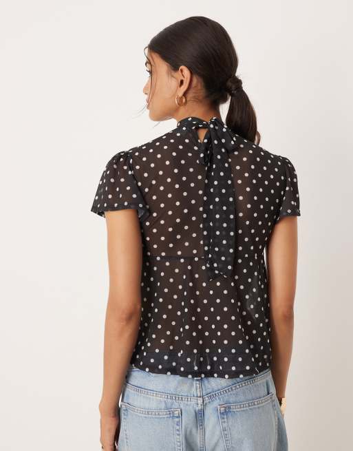 ASOS DESIGN floaty mesh flutter sleeve top with tie back detail in black polka dot