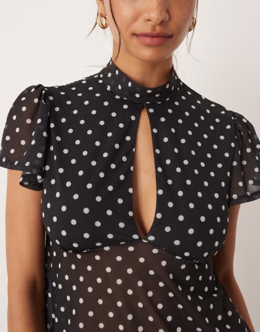 ASOS DESIGN floaty mesh flutter sleeve top with tie back detail in black polka dot