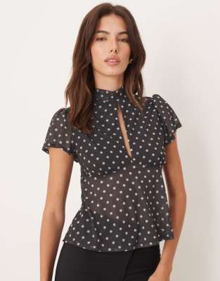 ASOS DESIGN floaty mesh flutter sleeve top with tie back detail in brown and white polka dot | ASOS