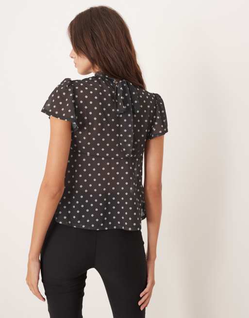 ASOS DESIGN floaty mesh flutter sleeve top with tie back detail in brown and white polka dot, 3 of 4