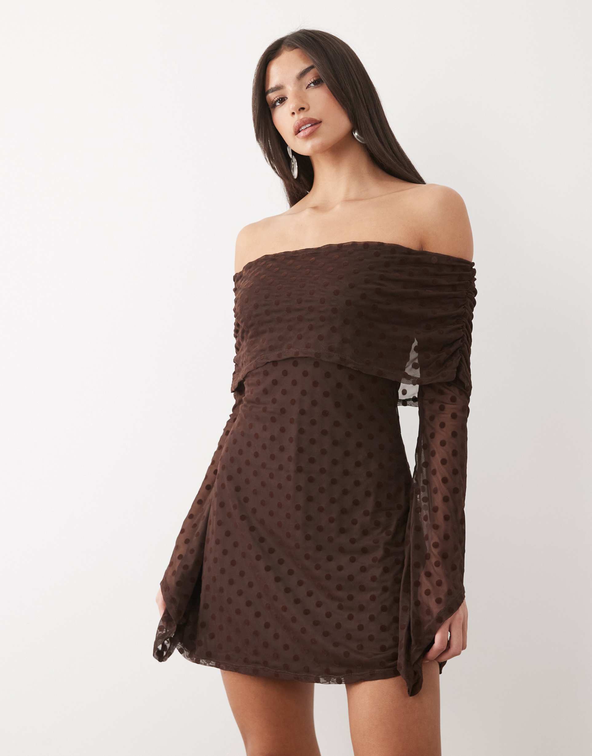 asos design flocked polka dot mini bardot off shoulder dress with exaggerated flute sleeve in brown