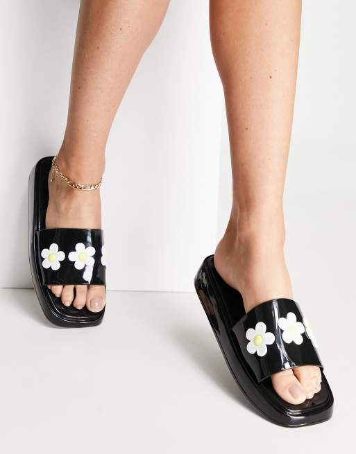 ASOS DESIGN Flora daisy sliders in black