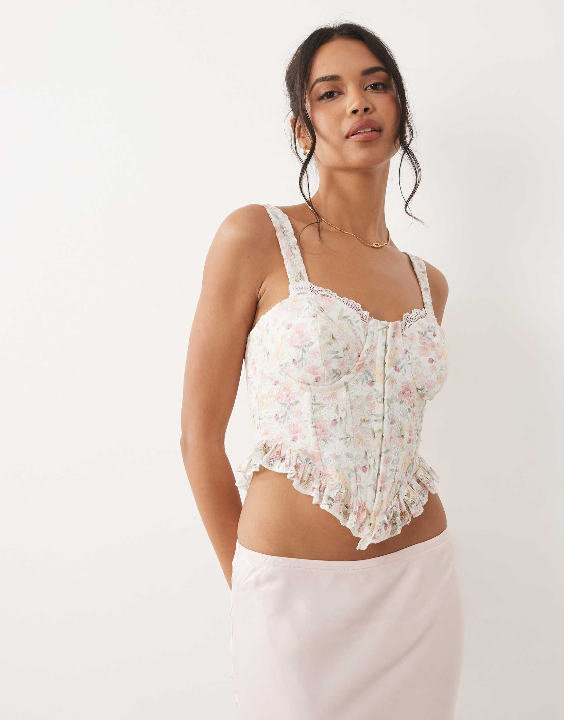 asos design floral lace corset top with ruffle hem in pink floral