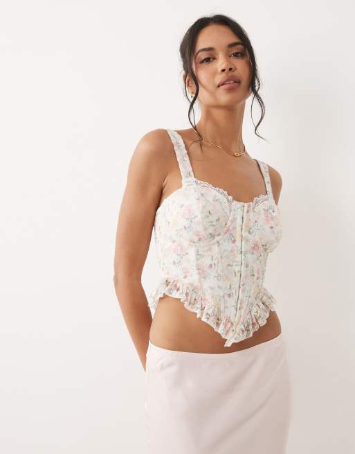 ASOS DESIGN floral lace corset top with ruffle hem in pink floral