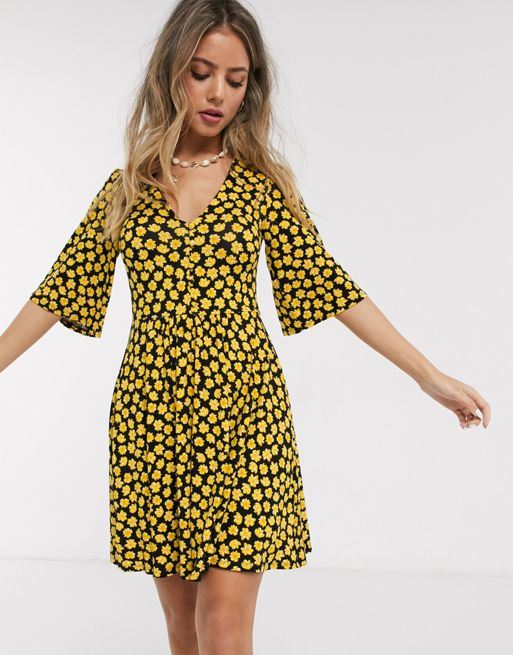 ASOS DESIGN floral mini button front swing dress in black and yellow