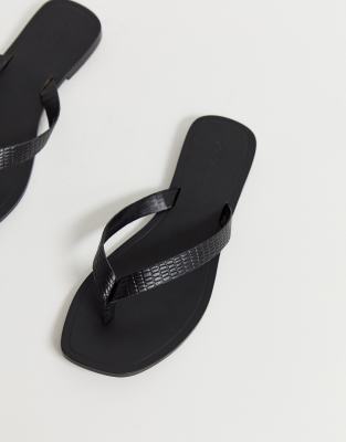 black leather flip flops