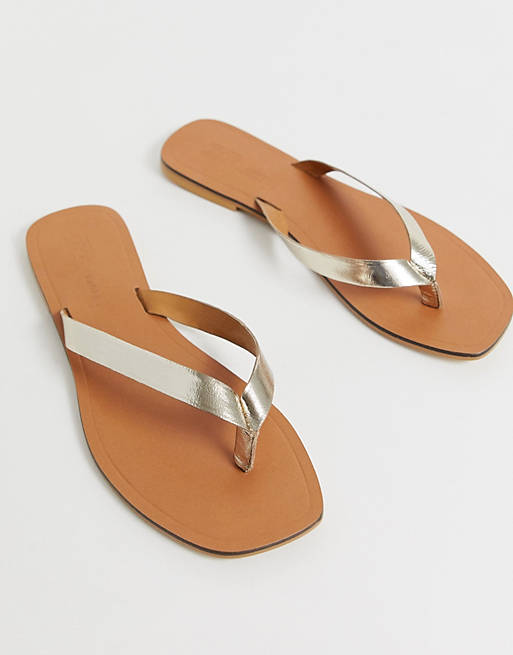 ASOS DESIGN Florence leather flip flop sandals in gold