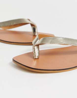 gold flip flops