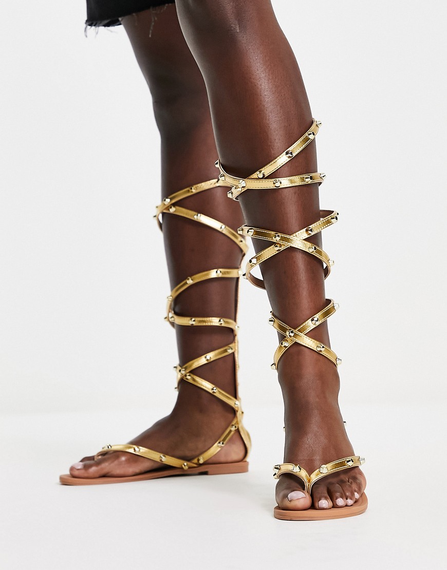 ASOS DESIGN Florida studded high leg gladiator flat sandals in gold