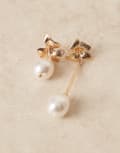 [ASOS DESIGN] ASOS DESIGN flower stud earrings with asymmetric pearl drop details in gold tone No Size GOLD