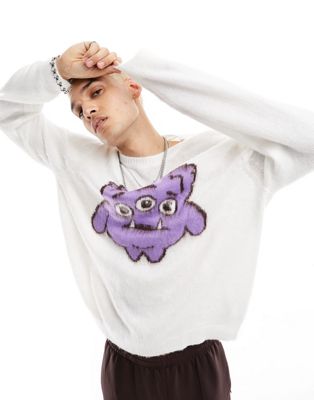 ASOS DESIGN knitted fluffy jumper with monster in cream
