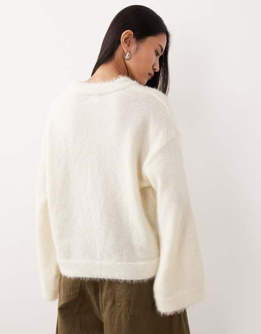 ASOS DESIGN fluffy wide sleeve knitted jumper in ecru