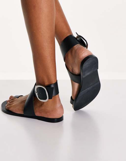 ASOS DESIGN Flyer leather toe loop flat sandals in black