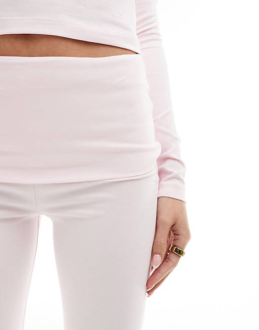 ASOS DESIGN fold-over waistband flared leggings in pink - part of