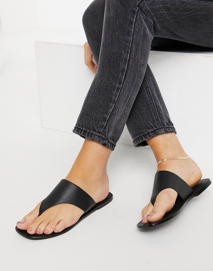 ASOS DESIGN Folly leather toe thong sandals in black