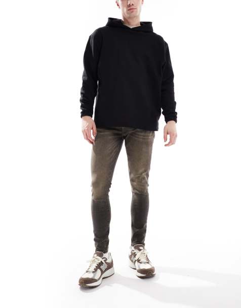 ASOS DESIGN - Forvaskede sorte spray on-jeans med power-stretch og farvede detaljer - view 1