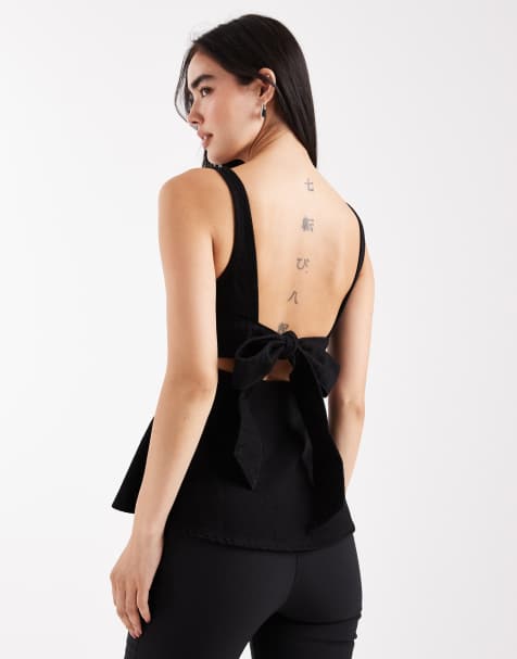 ASOS DESIGN - Forvasket sort peplum-top med sløjfe bagpå i denim - view 1