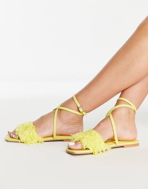 ASOS DESIGN Four faux feather flat sandals in yellow