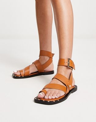 ASOS DESIGN Foxy leather studded toe loop flat sandal in tan