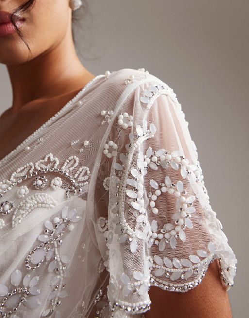 ASOS DESIGN Frankie beaded mesh plunge cap sleeve wedding dress in ivory