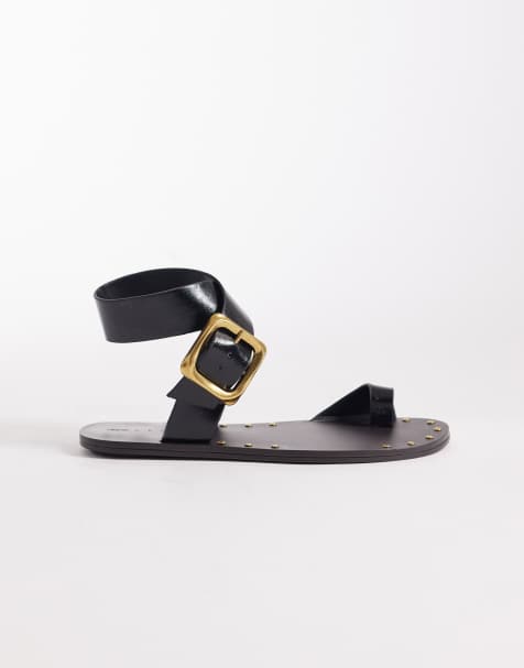 ASOS DESIGN Freely toe loop cross strap flat sandals in black - view 1