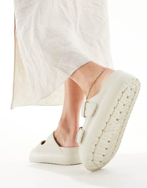 ASOS DESIGN Freestyle flatform double buckle footbed slides in beige, 3 of 4