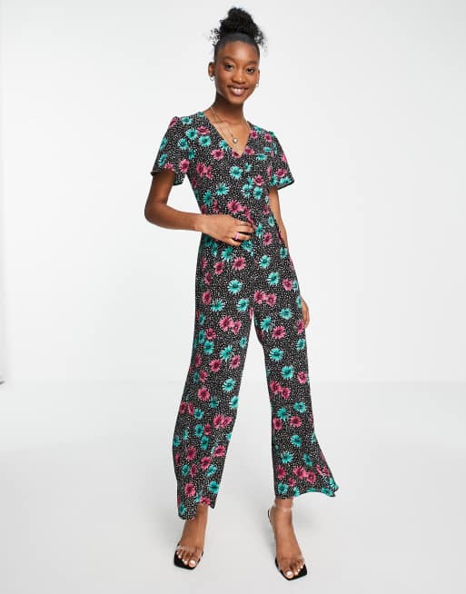 ASOS DESIGN – Freizeit-Jumpsuit aus Blasenkrepp mit blumigem Punktemuster und Knopfleiste