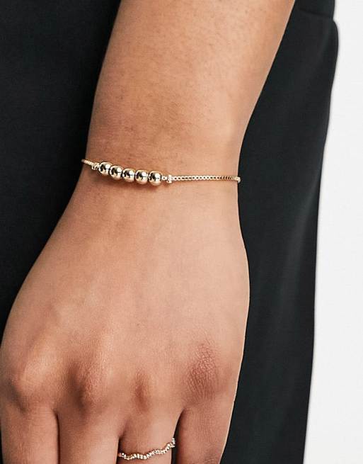 ASOS DESIGN friendship bracelet with ball detail in gold tone ASOS