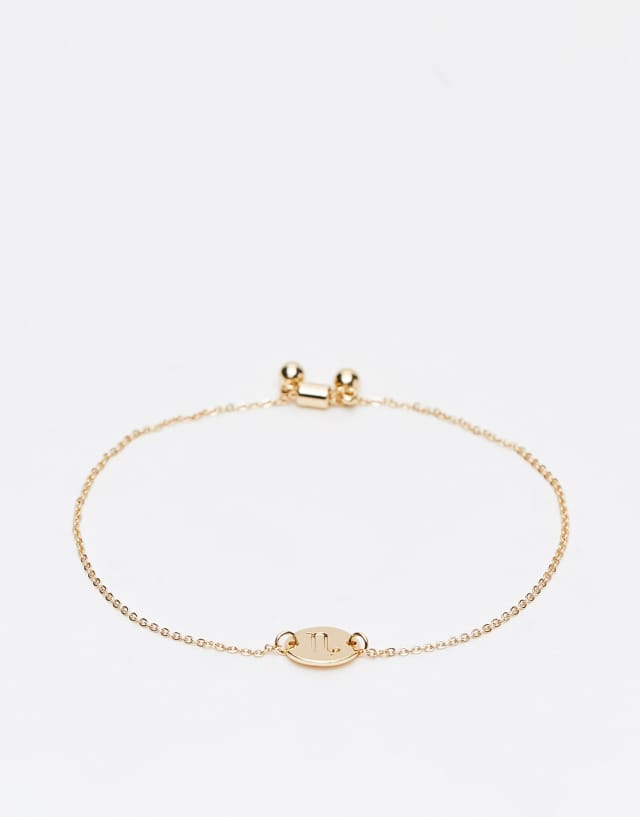 ASOS DESIGN friendship bracelet with Capricorn star sign in gold tone