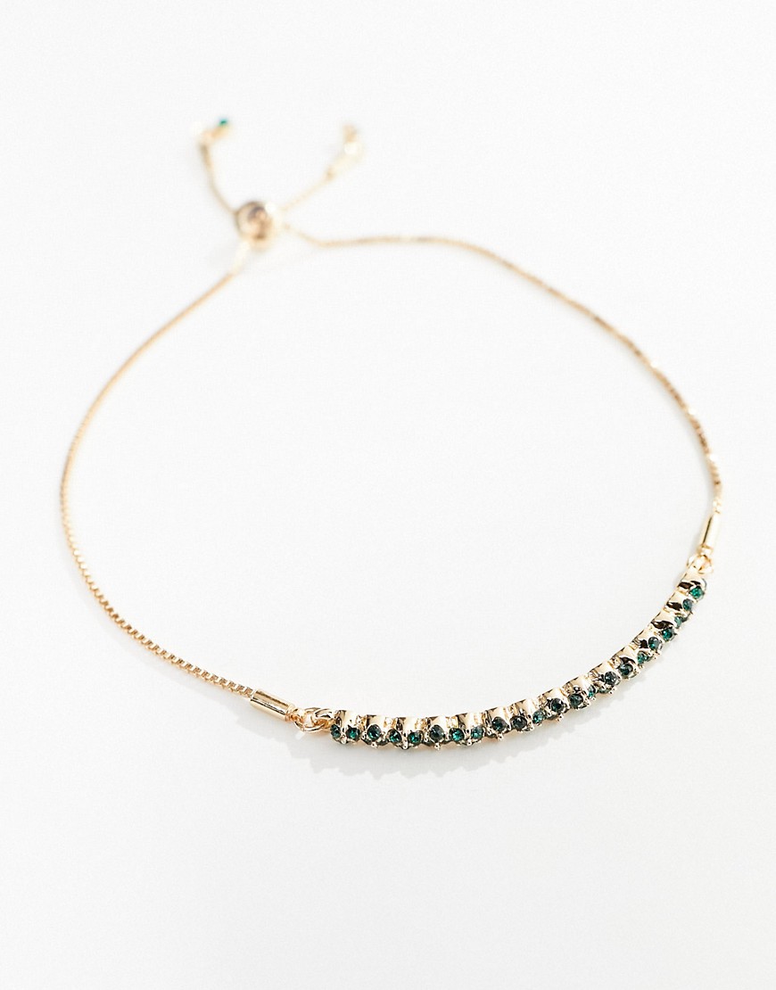 ASOS DESIGN friendship bracelet with emerald and crystal gold cuff design in gold tone