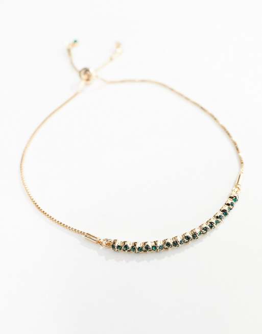 ASOS DESIGN friendship bracelet with emerald and crystal gold cuff ...