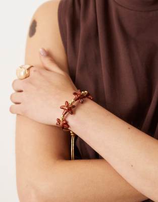 ASOS DESIGN ASOS DESIGN friendship bracelet with tortoise shell starfish in gold tone-Brown