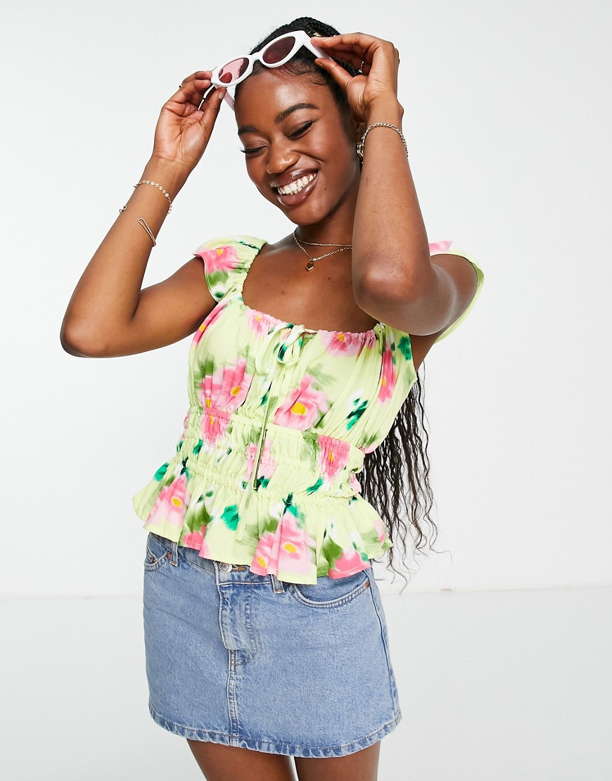 ASOS DESIGN frill sleeve top with channel waist detail in green & rose print-Multi