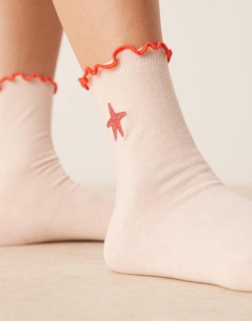 ASOS DESIGN frill top socks with embroidered starfish design in pink 